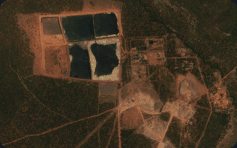 Animated satellite observations of a mining site, showing tailings dams, rock waste dumps and infrastructure detected over time.
